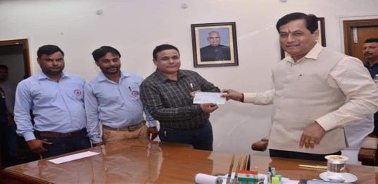 During Cheque handed over to CM Emergency relief Fund